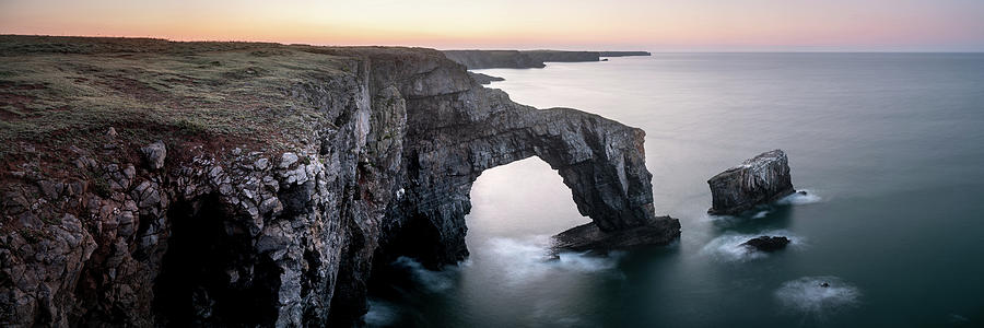 Green Bridge of Wales Sunrise Stack Rocks Pembrokeshire Coast and Cliffs Wales Photograph by Sonny Ryse