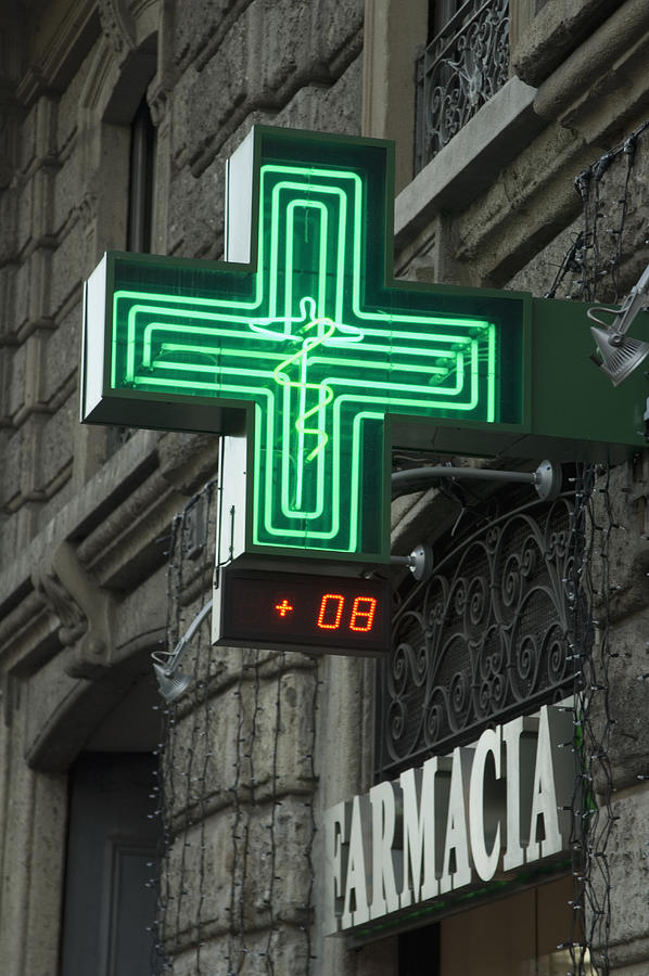 Green Cross sign of Farmacia in MIlan Italy Photograph by Peter Hince