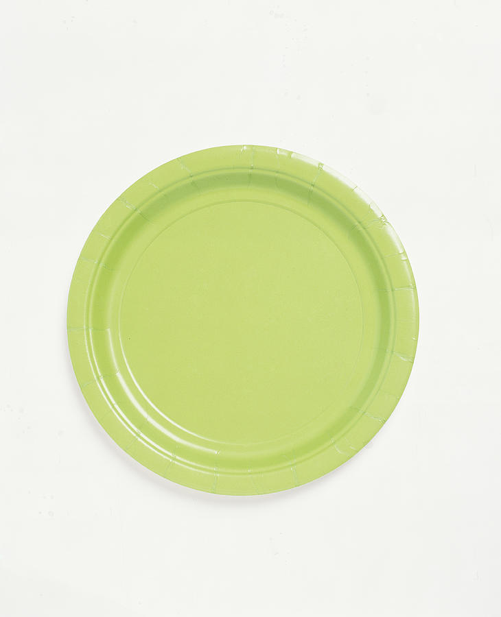 Green paper plate, overhead view Photograph by James Baigrie