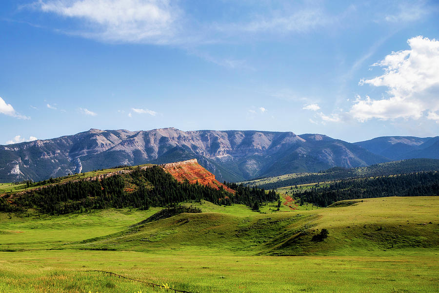 Green rolling hills and mountains in a Wyoming summer landscape ...