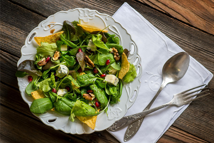 Green salad with tortilla chips Photograph by Galyaivanova