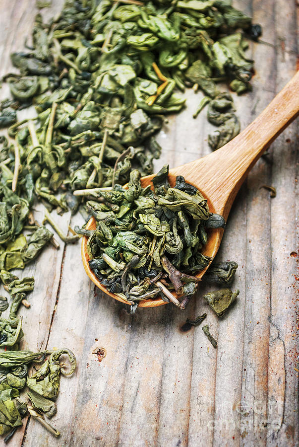 Green tea in wooden spoon Photograph by Jelena Jovanovic