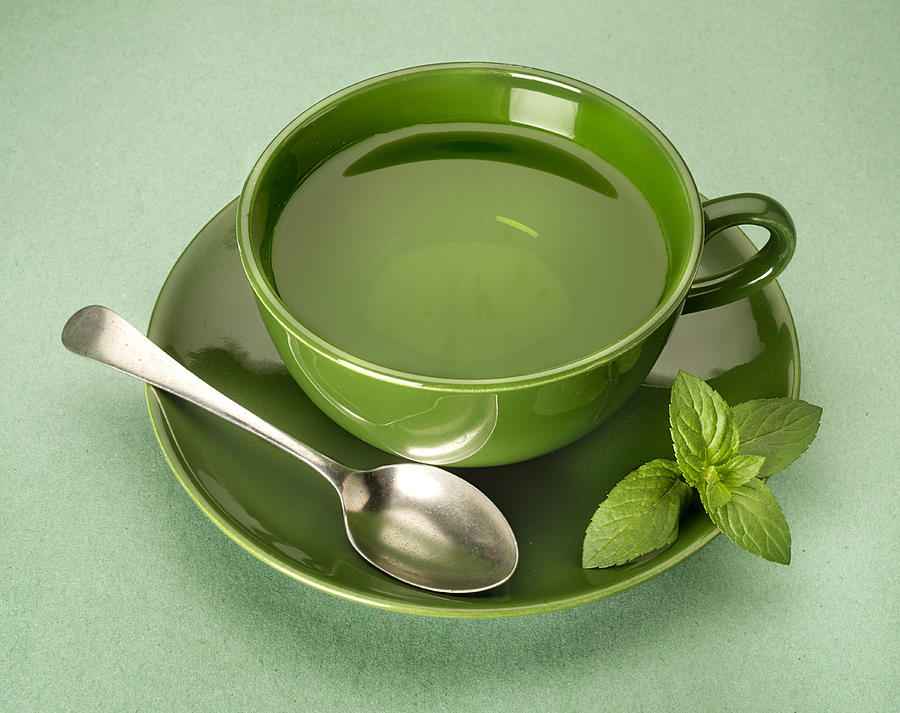 Green Tea On Green Background Photograph by ATU Images