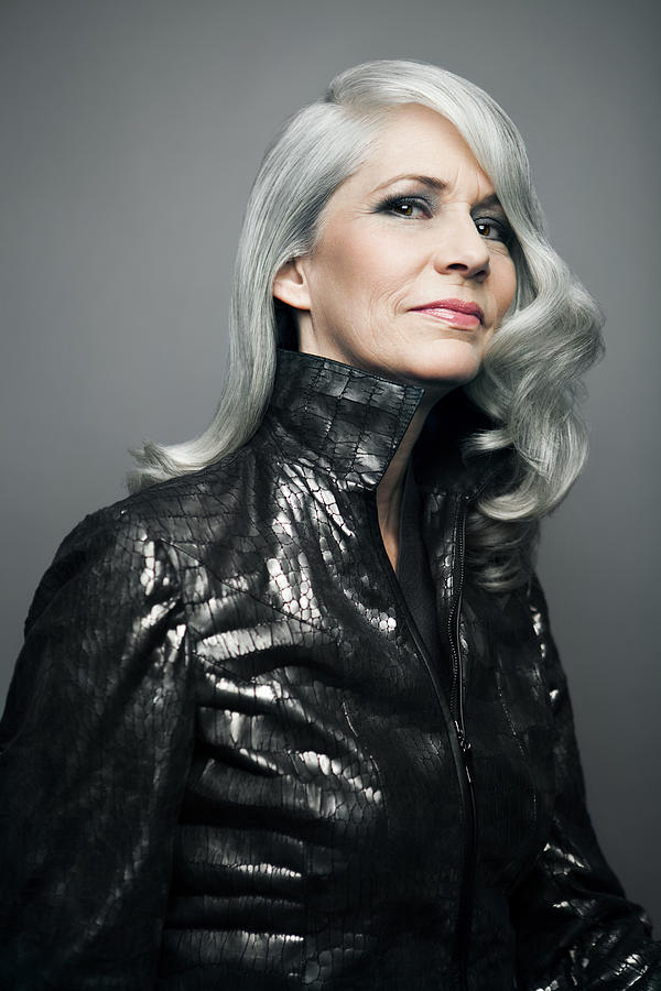 Grey haired lady in a stylish jacket, portrait. Photograph by Andreas Kuehn