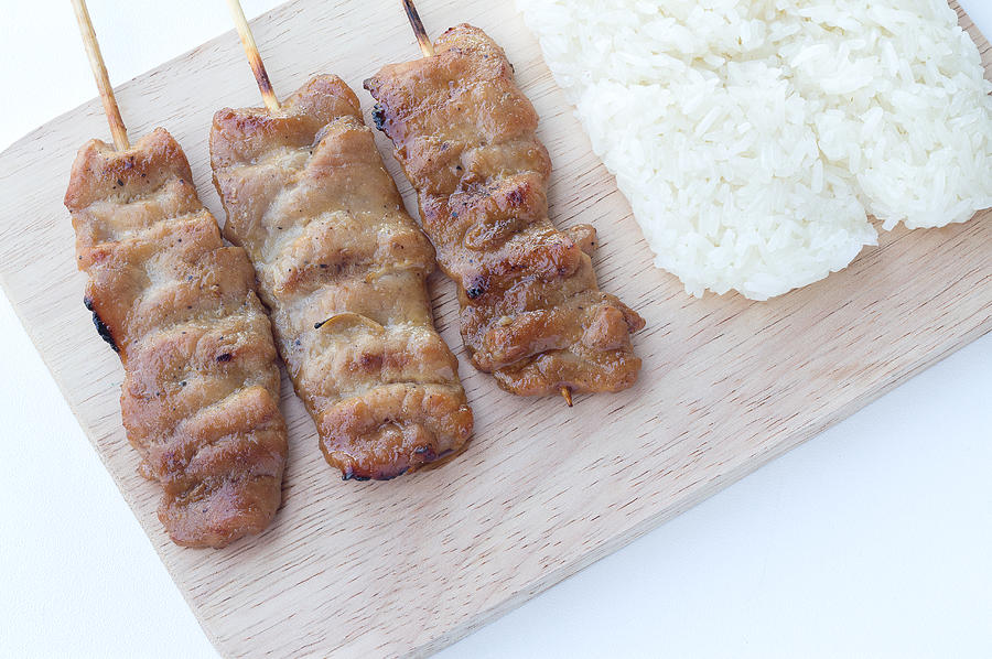 Grilled pork in asian style sticky rice Photograph by Akkalak