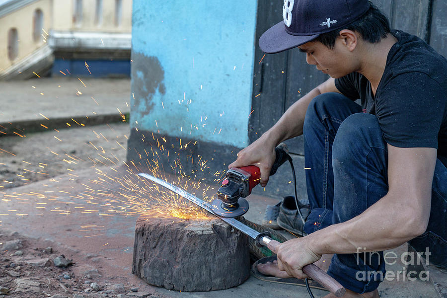 Grinding Traditional Laos Sword Photograph by Danaan Andrew - Fine Art ...