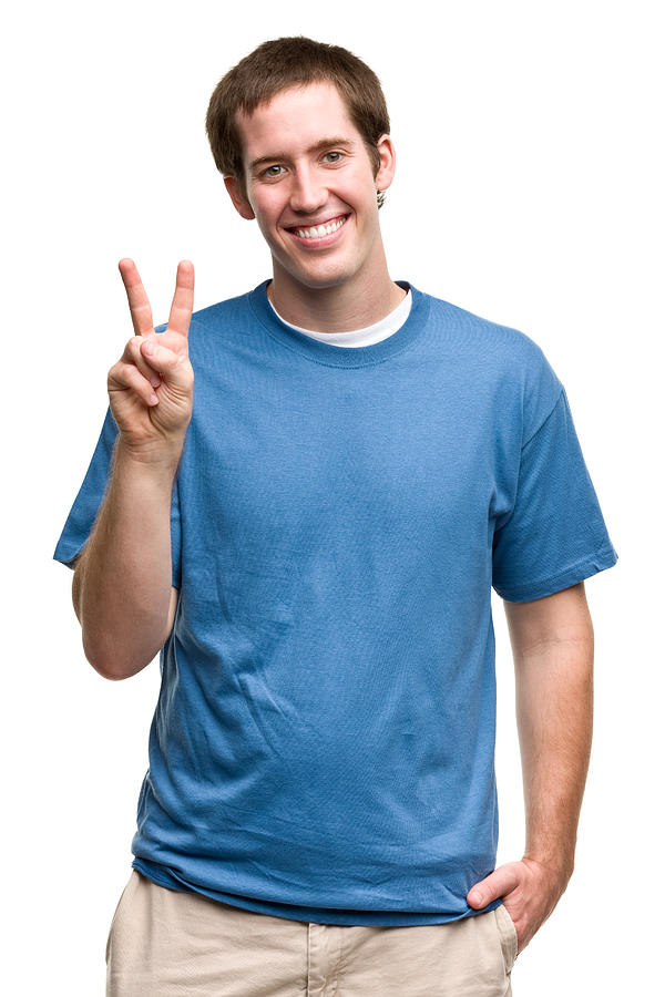 Grinning Young Man Gives Peace Sign Photograph by Drbimages