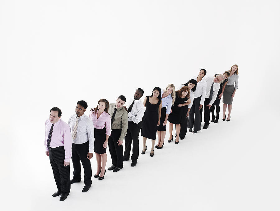 Group of business people standing in a line Photograph by Flashpop