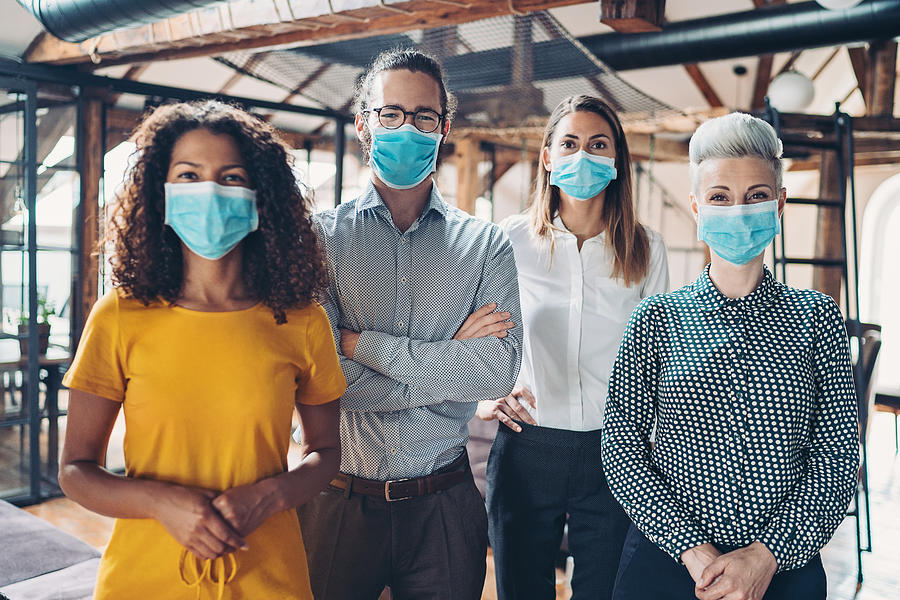 Group of business persons with face masks Photograph by Pixelfit