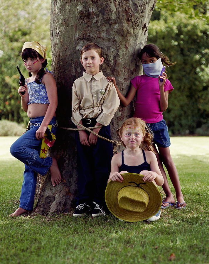 Group of children playing robbers and sheriffs Photograph by Roger Wright