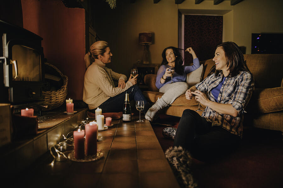 Group of Female Friends Relaxing at Home Photograph by SolStock