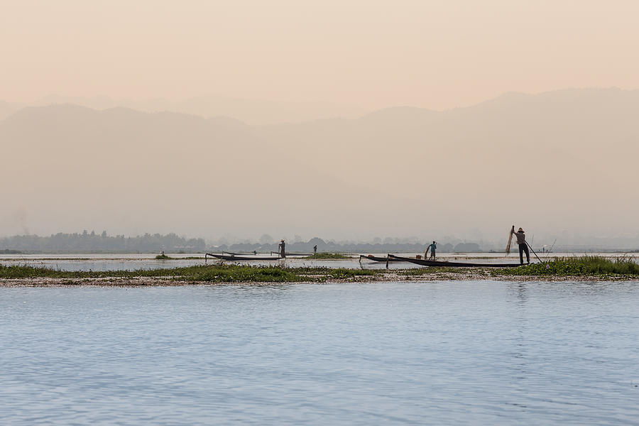 Group of fishermen on Inle Lake Photograph by Merten Snijders
