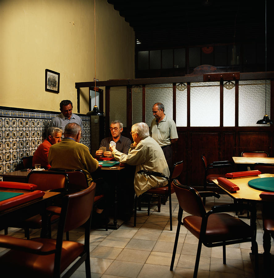 Group of mature men playing cards in bar Photograph by Kelvin Murray