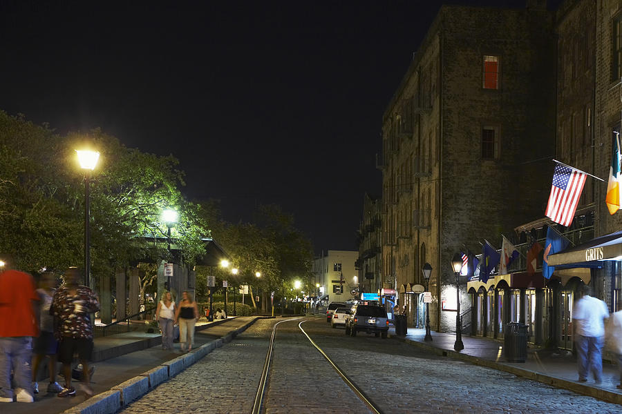 Group of people walking on the walkway at night, Savannah, Georgia, USA Photograph by Glowimages