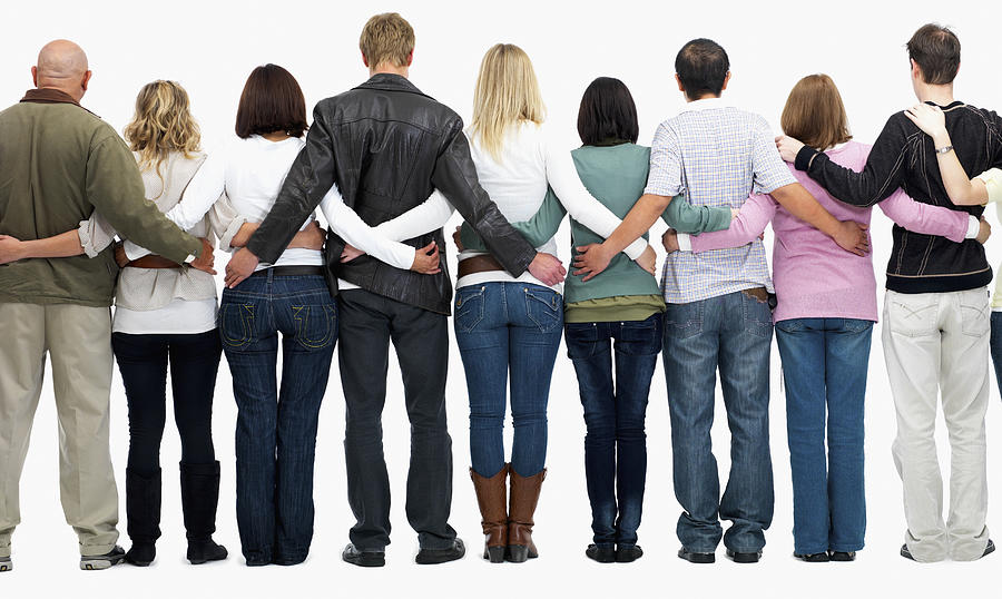 Group of people with their arms around each others backs Photograph by Momentimages