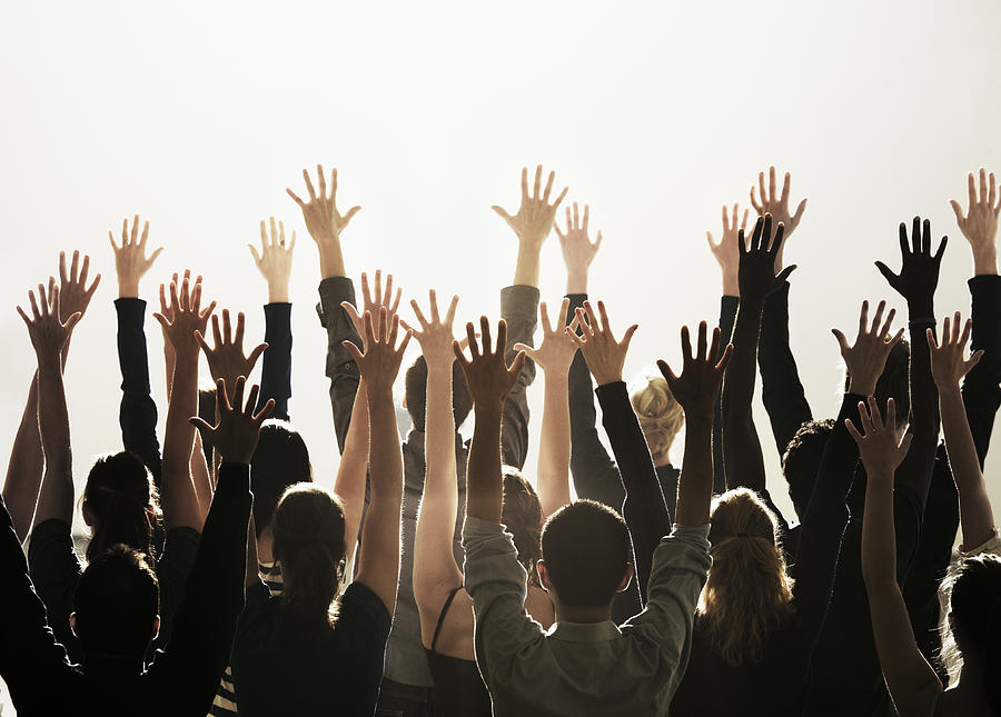 Group Of People With Their Hands Raised Photograph by Henrik Sorensen