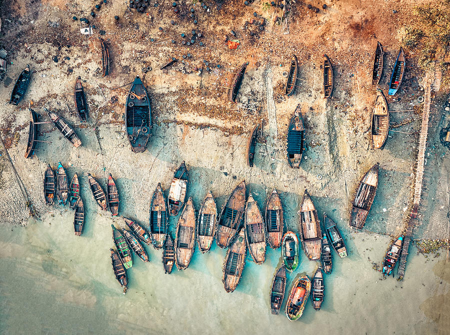 Group of scattered small ships at Chittagong port, Bangladesh Photograph by Shihan Shan
