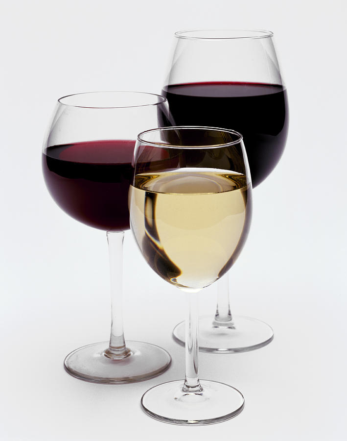 Group of three wine glasses Photograph by Nicholas Eveleigh Group of three wine glasses Photograph by Nicholas Eveleigh