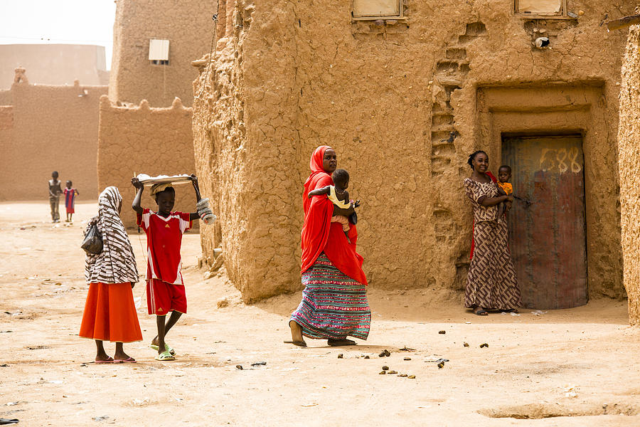 Group of woman in the streets of Agadez Photograph by SeppFriedhuber
