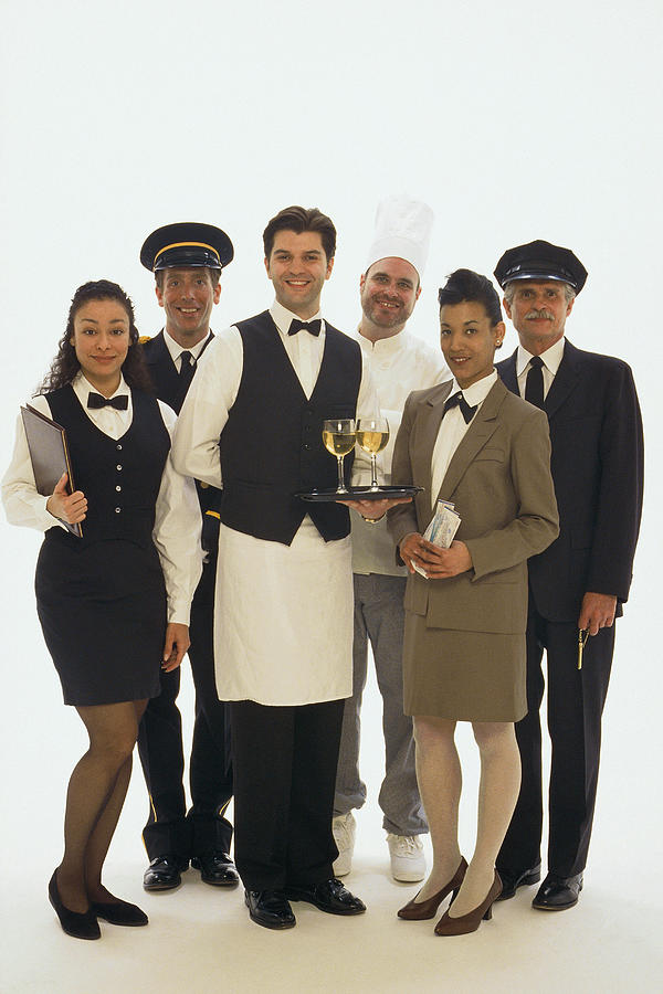 Group portrait of hotel staff Photograph by Comstock