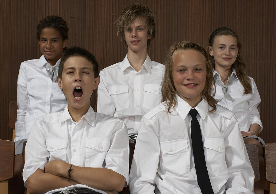 Group portrait of school children (12-14) in uniforms at assembly hall Photograph by Ulrik Tofte