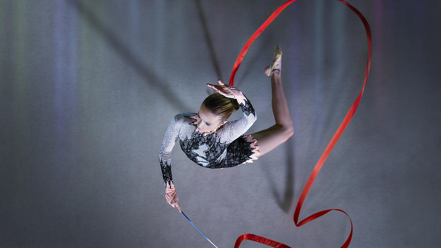 Gymnast performing with ribbon Photograph by Simonkr