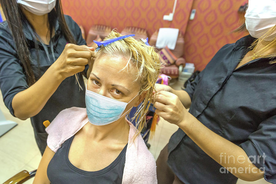 Hair Dressers With A Surgical Mask Photograph by Benny Marty