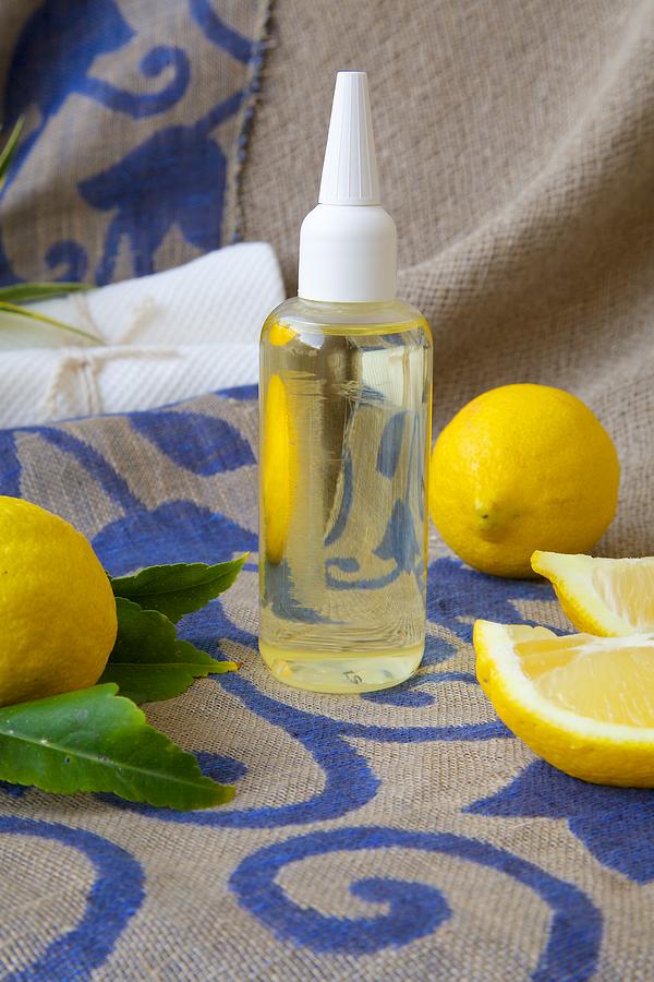 Hair serum with lemon essential oil Photograph by TolikoffPhotography