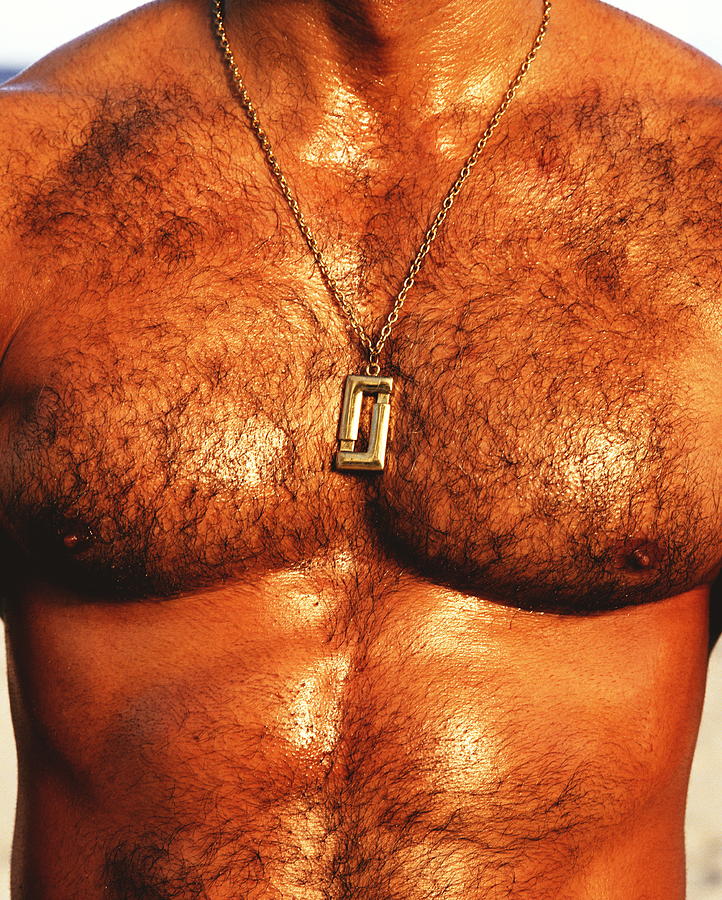 Hairy chested man wearing gold chain, mid section Photograph by Tim Macpherson