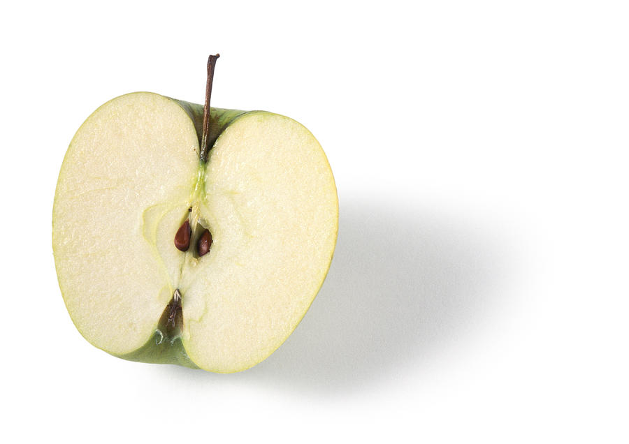 Half an apple, white background Photograph by Isabelle Rozenbaum