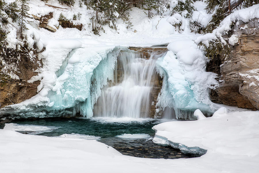 Half Frozen Waterfall in Banff Photograph by Alex Mironyuk