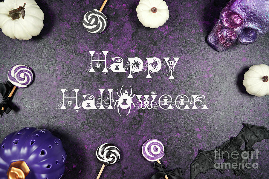 Halloween Photograph - Halloween trick or treat flatlay on purple background with white by Milleflore Images
