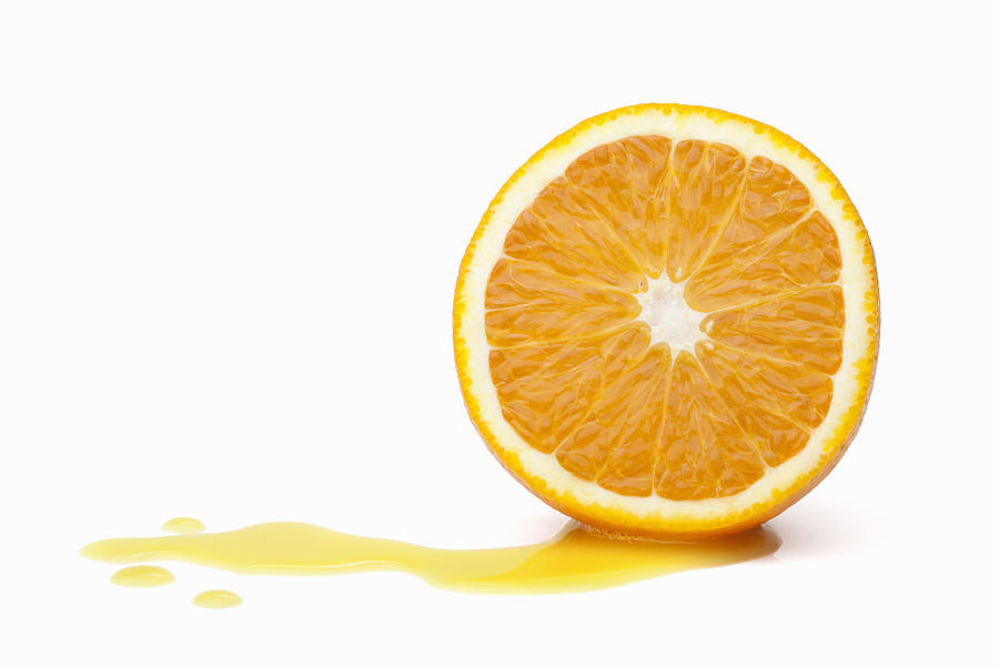 Halved orange with juice Photograph by Tiina & Geir