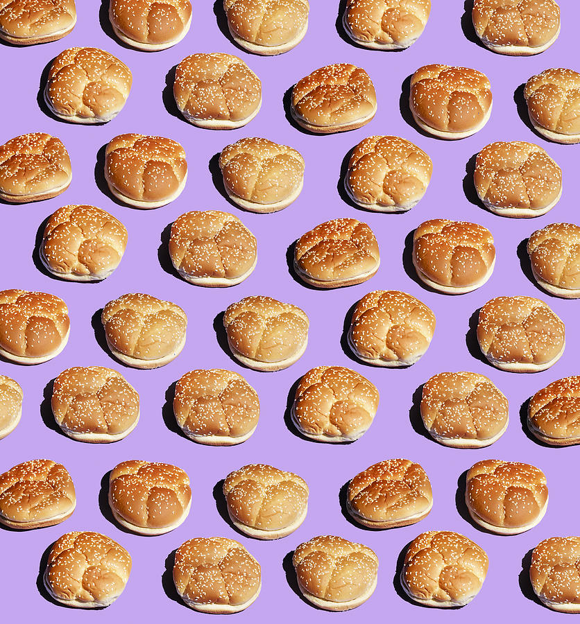 Hamburger buns on purple background Photograph by Maren Caruso