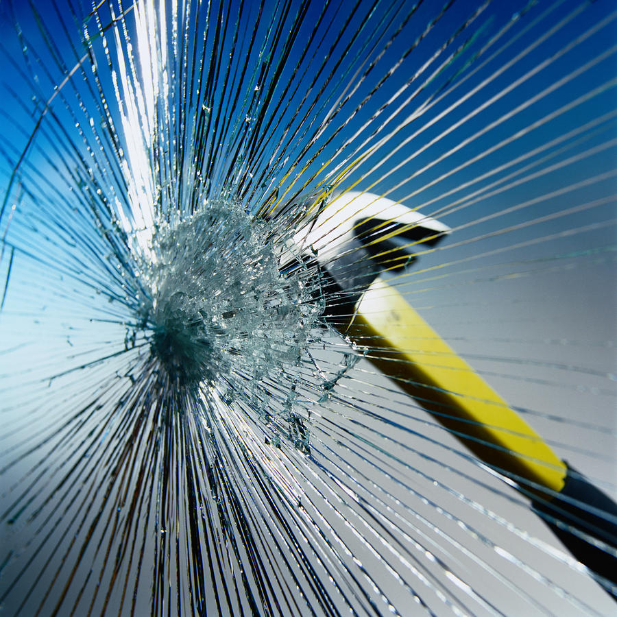 Hammer Hitting Glass Photograph by Photodisc