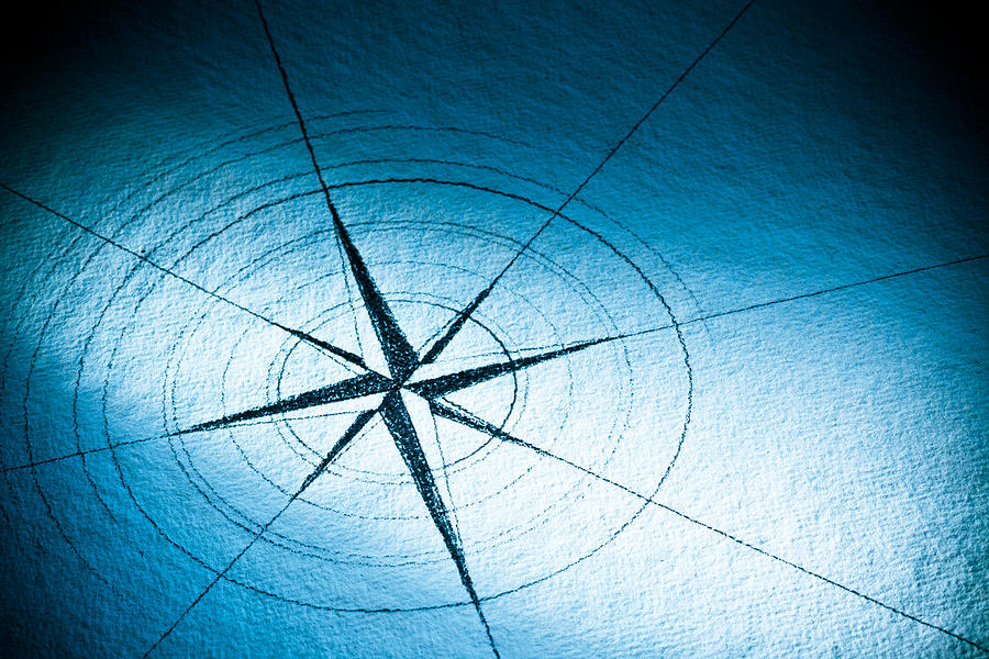 Hand-drawn compass rose on blue paper Photograph by LdF