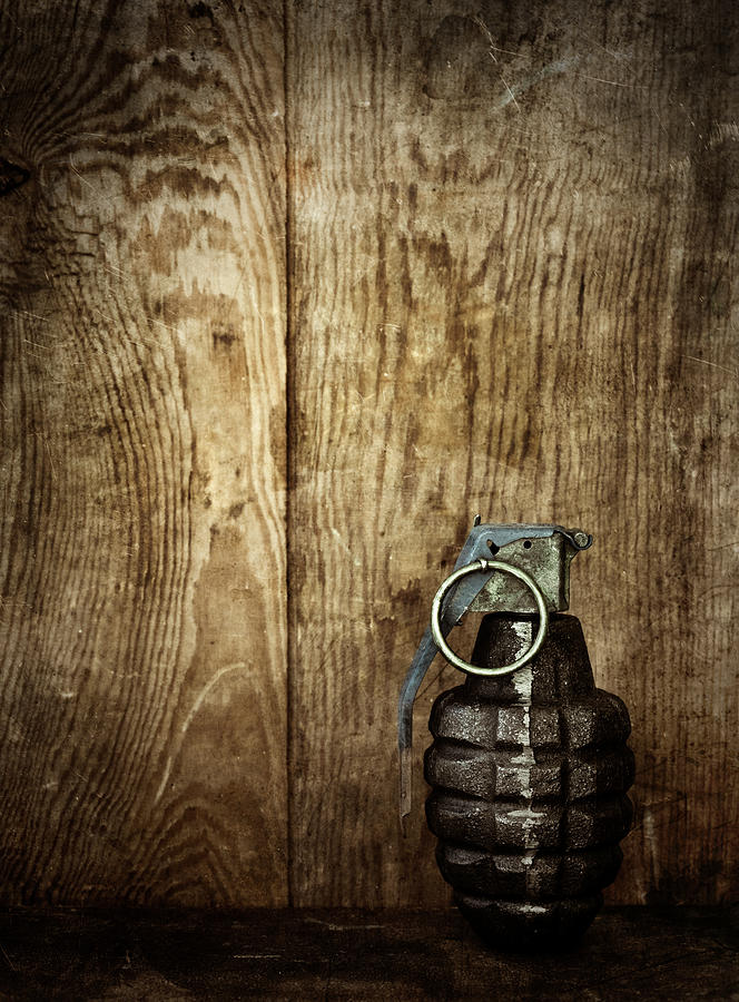 Hand Grenade On Wooden Background Photograph by Thepalmer