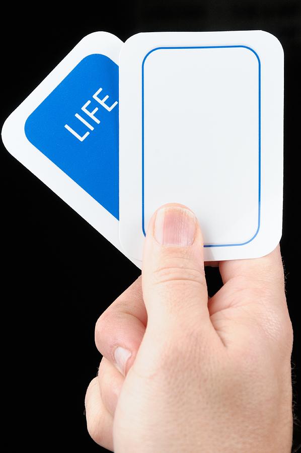 Hand holding blank life card Photograph by Sshepard
