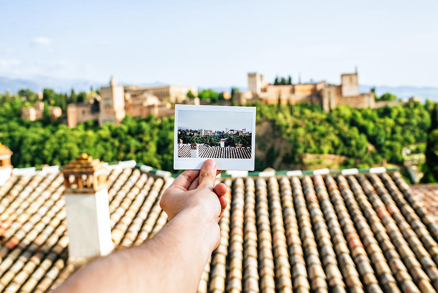 Hand holding instant photo of the Alhambra, Granada Photograph by F.J. Jimenez