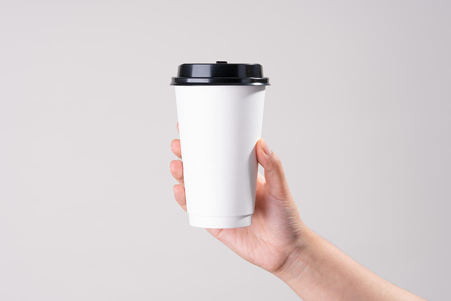 Hand Holding White Paper Cup Photograph by MirageC
