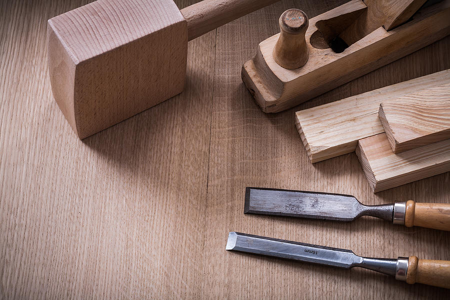 Hand mallet planer metal chisels and wooden stud on wood Photograph by Mihalec