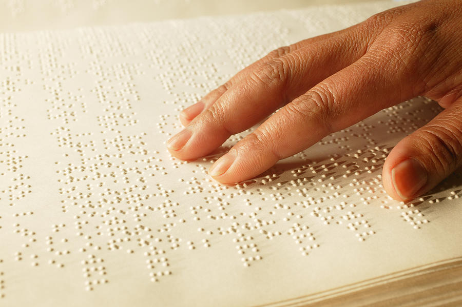 Hand on Braille book Photograph by Hill Street Studios
