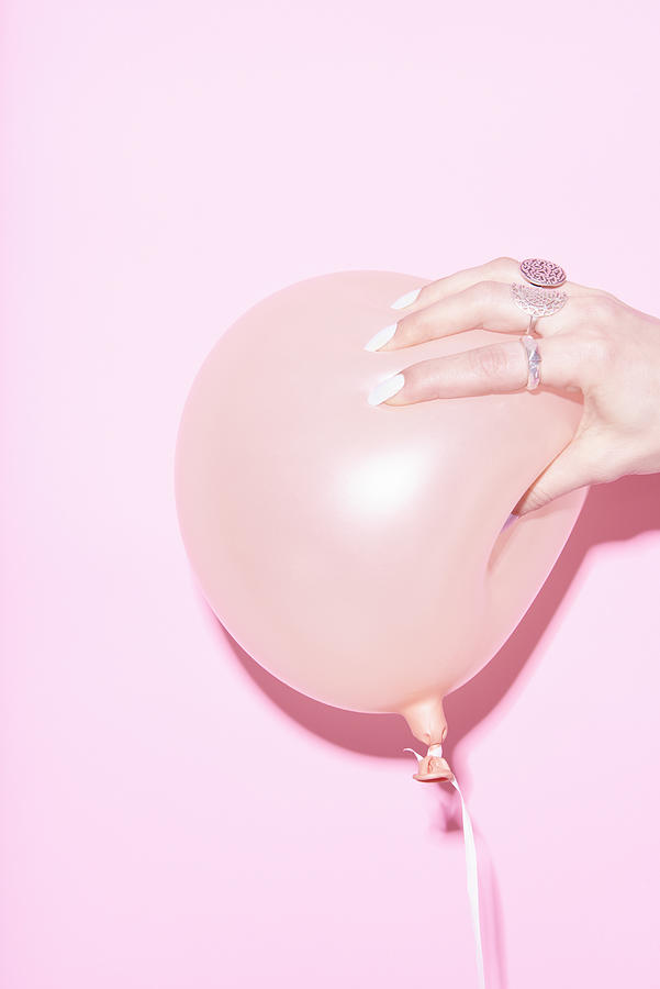 Hand Squeezing Pink Balloon Photograph by Tara Moore
