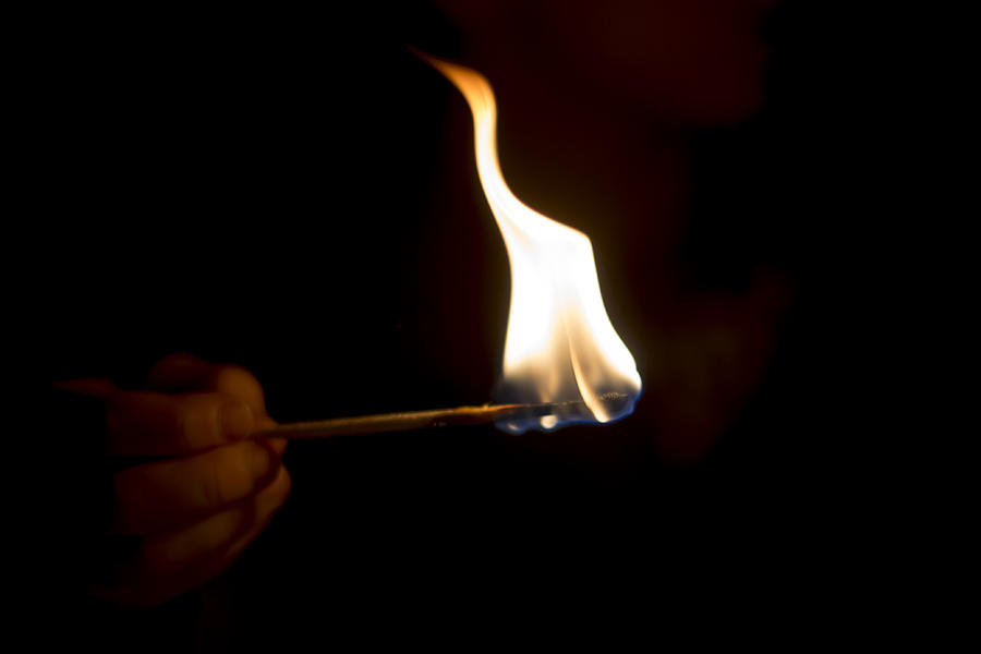 Hand With Burning Matchstick Photograph by Lacaosa