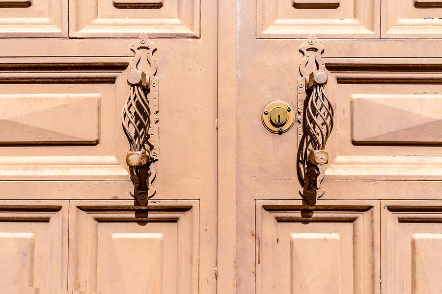 Handcrafted metal door handles Photograph by Flottmynd