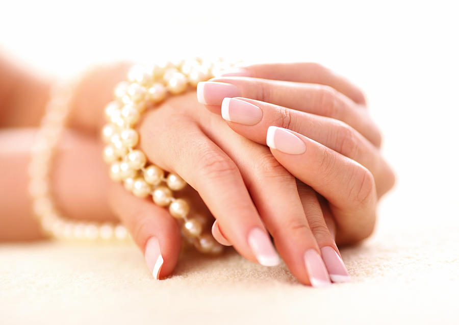 Hands and pearls. Photograph by Gilaxia