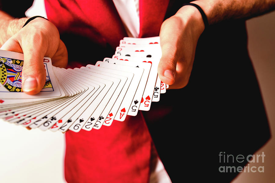 Hands of magician doing tricks with a deck of cards. Photograph by Joaquin Corbalan