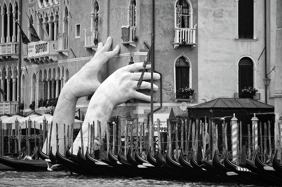 Hands of Support Rising Above Gondolas on the Grand Canal in Venice Italy Black and White Photograph by Shawn OBrien