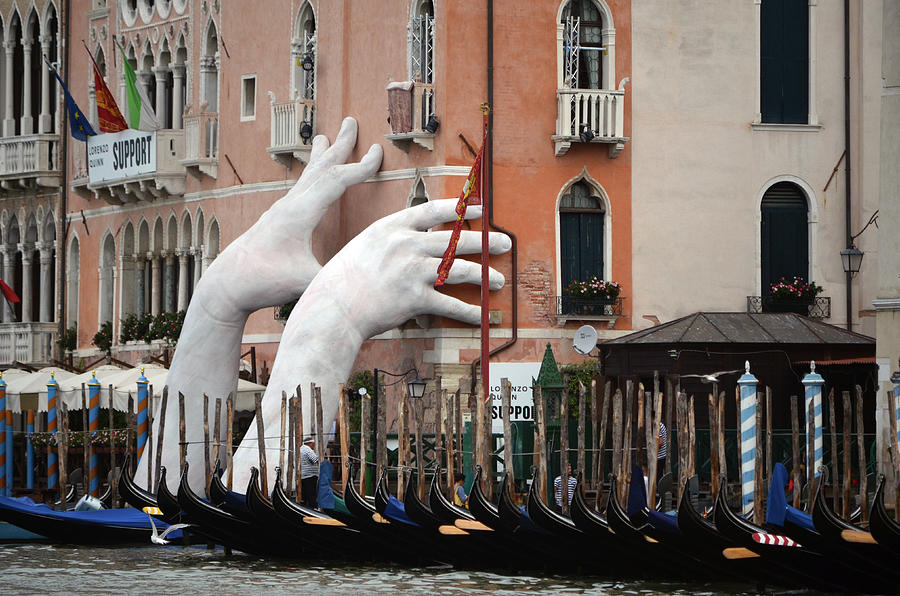 Hands of Support Rising Above Gondolas on the Grand Canal in VeniceItaly Photograph by Shawn OBrien