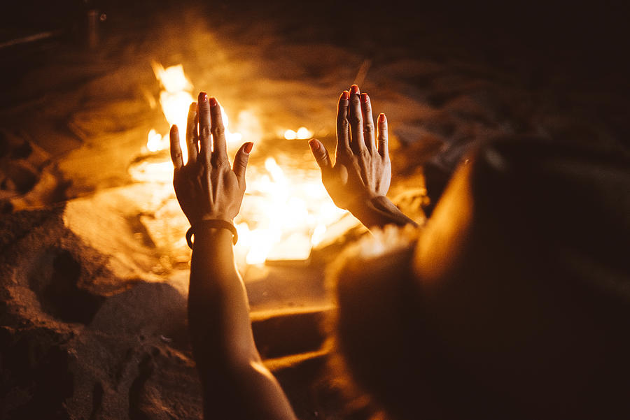 Hands warming up to fireplace Photograph by Mihailomilovanovic